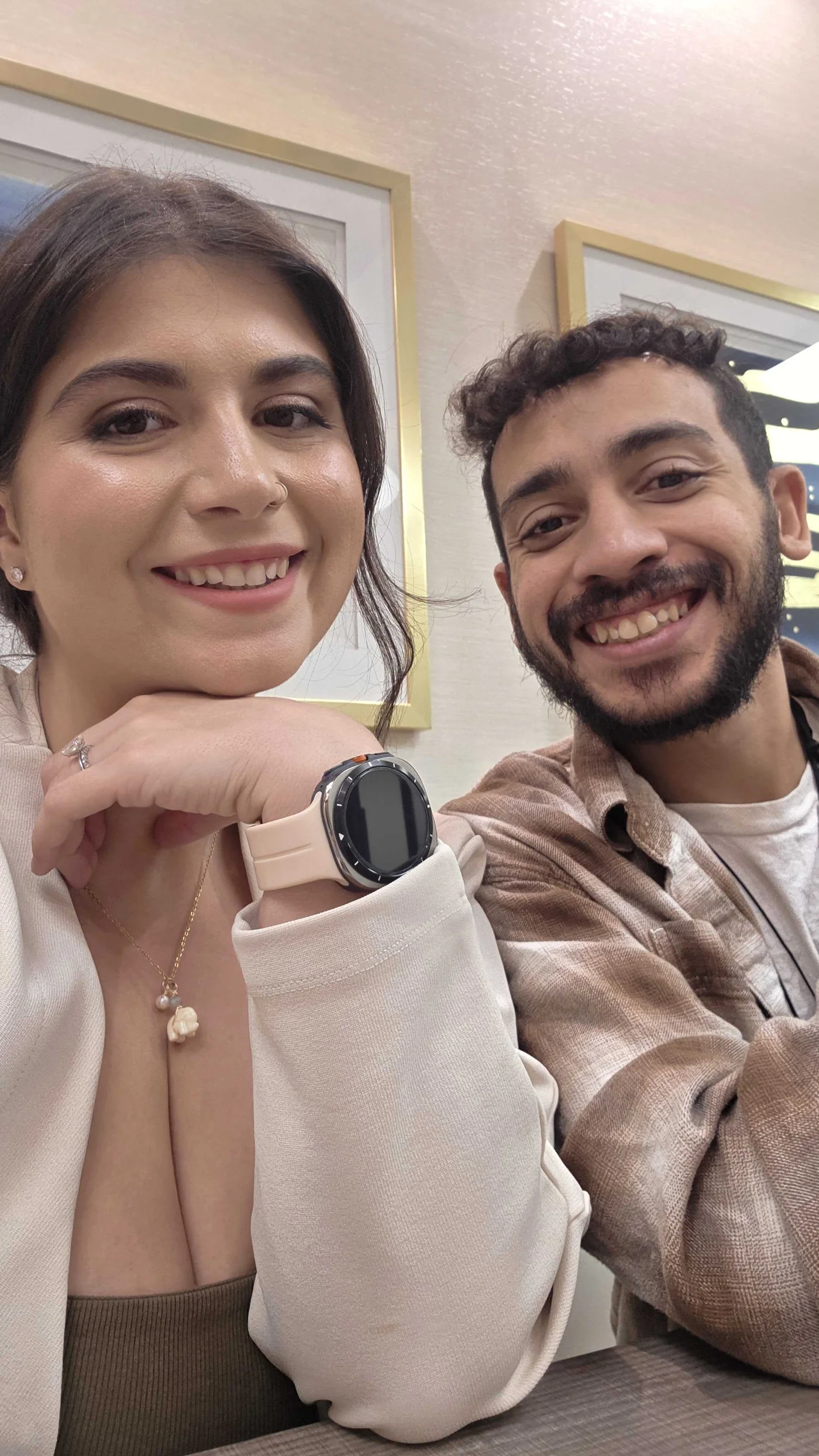 ToniMarie smiling with her husband during a casual food outing