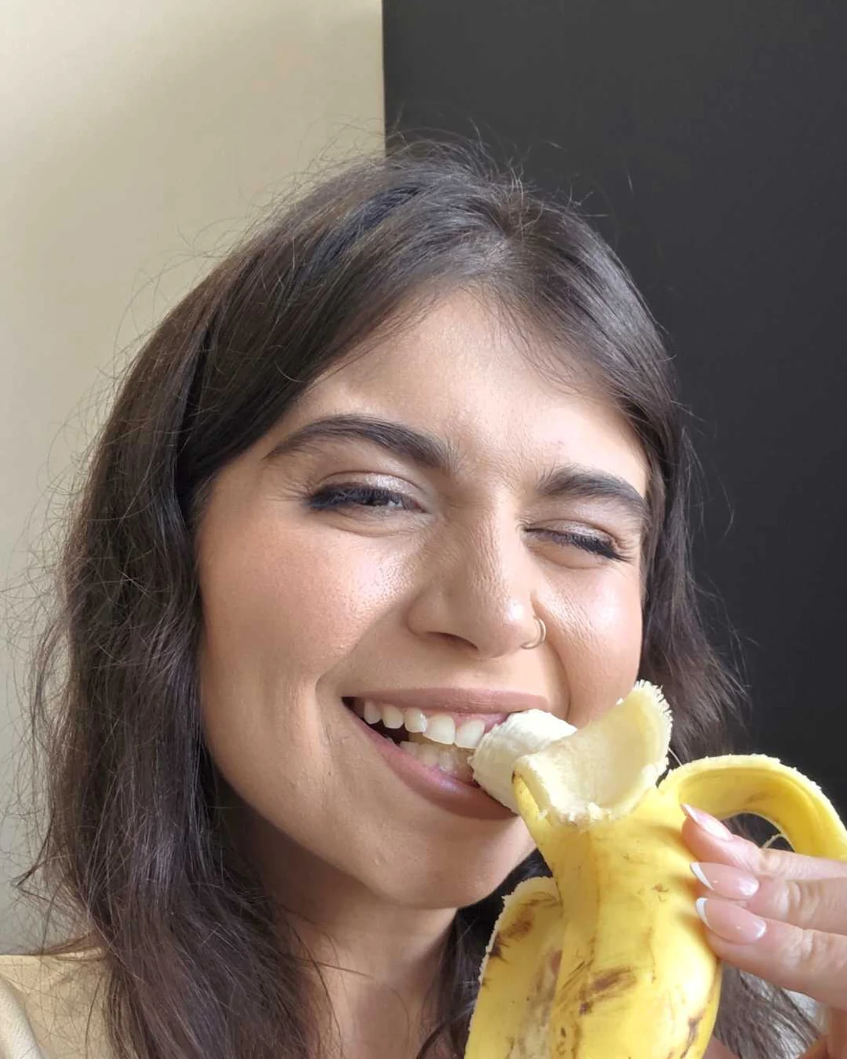 ToniMarie smiling with a banana